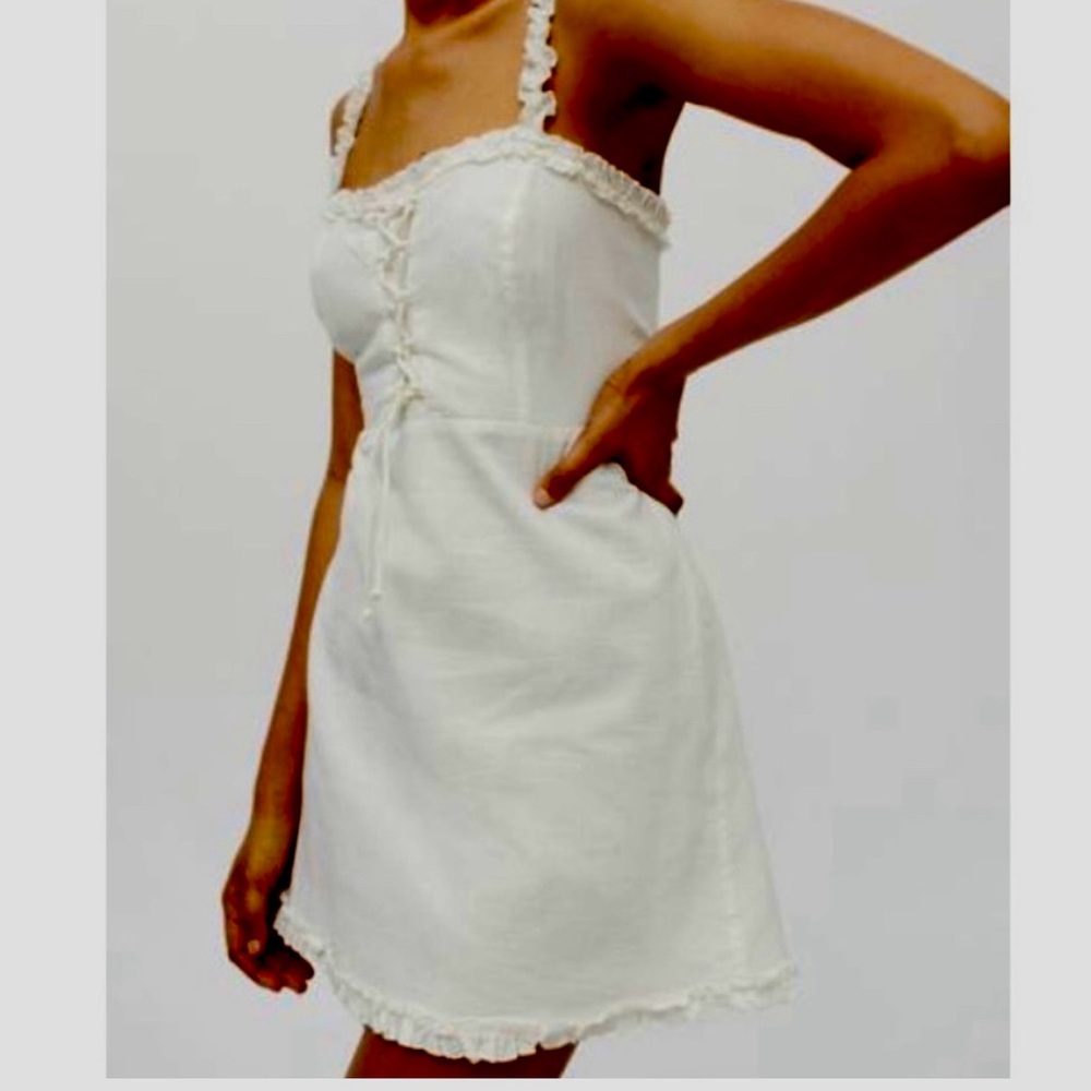 Urban Outfitters White linen mini dress with Lace-Up front and ruffle trim -XS